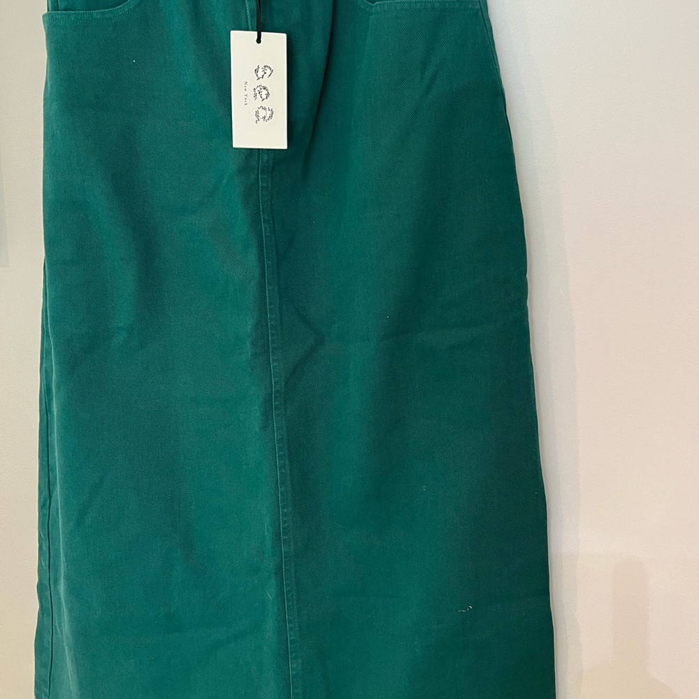 Brand new never worn w tags . Long green skirt slightly Aline. Size 6